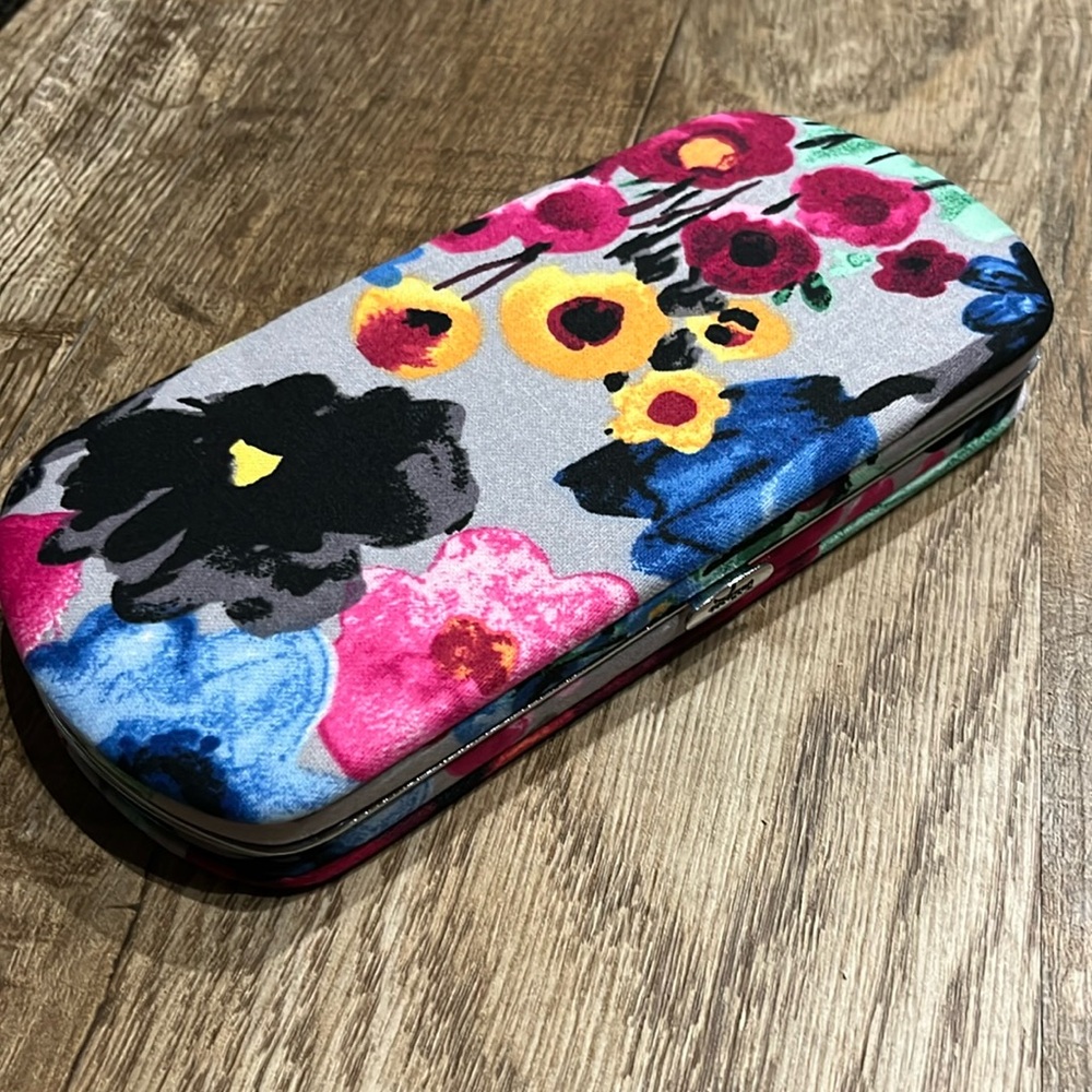 Thirty-one gifts hard case wallet.  Pretty floral print